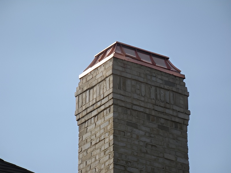 Installed copper chimney cap