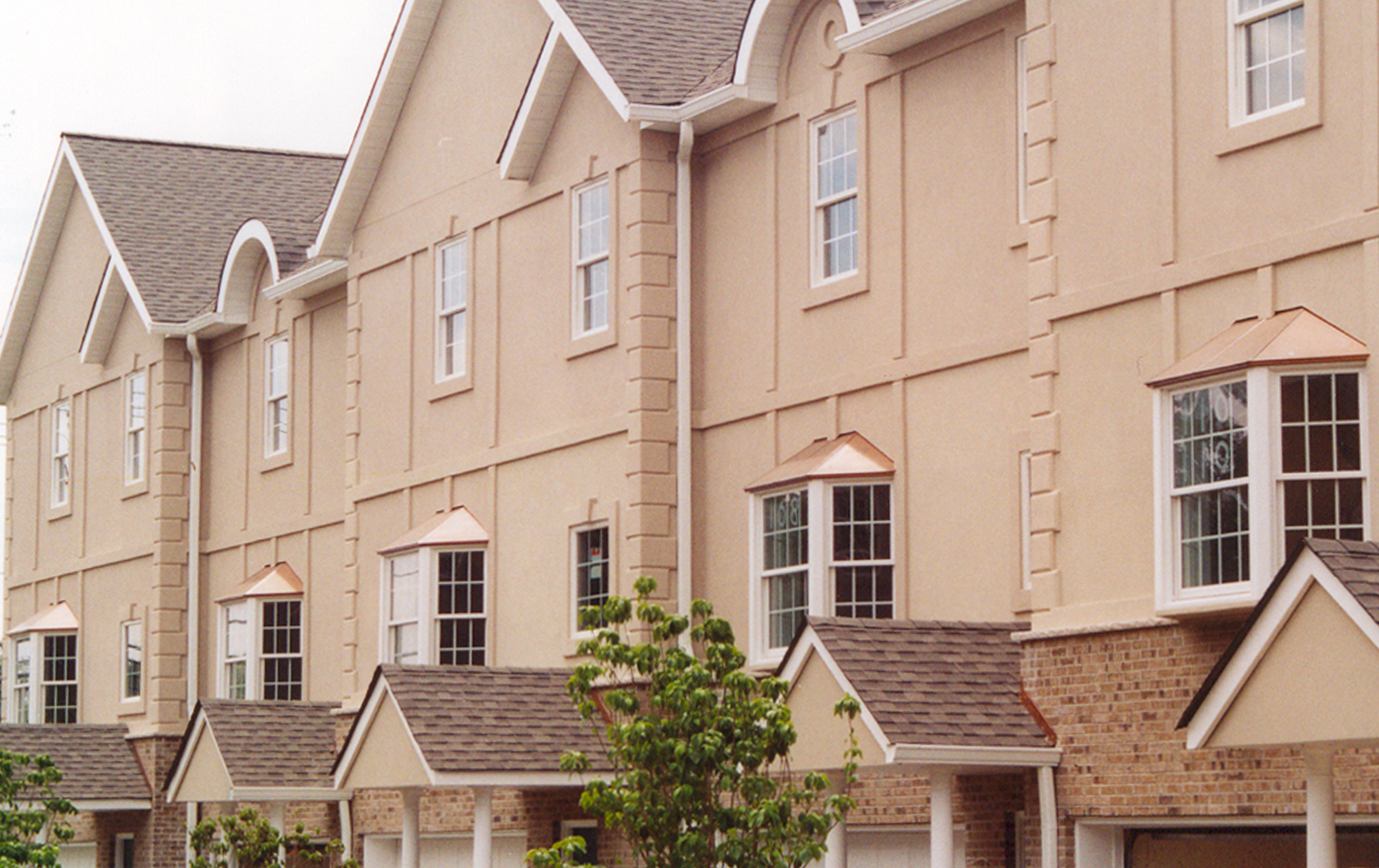 Townhomes with copper islander bay windows