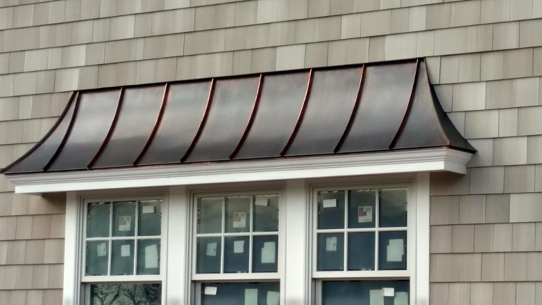 Door canopy with brown patina