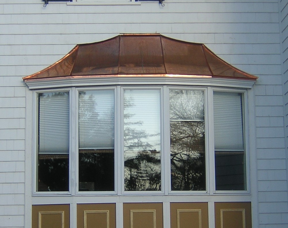 5 paneled bow window with a copper roof