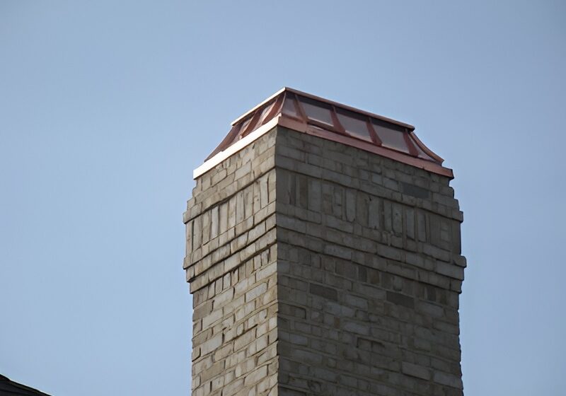 Installed copper chimney cap